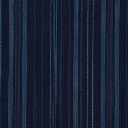 Vertical navy blue stripe fabric with alternating light and dark denim tones; textured textile.