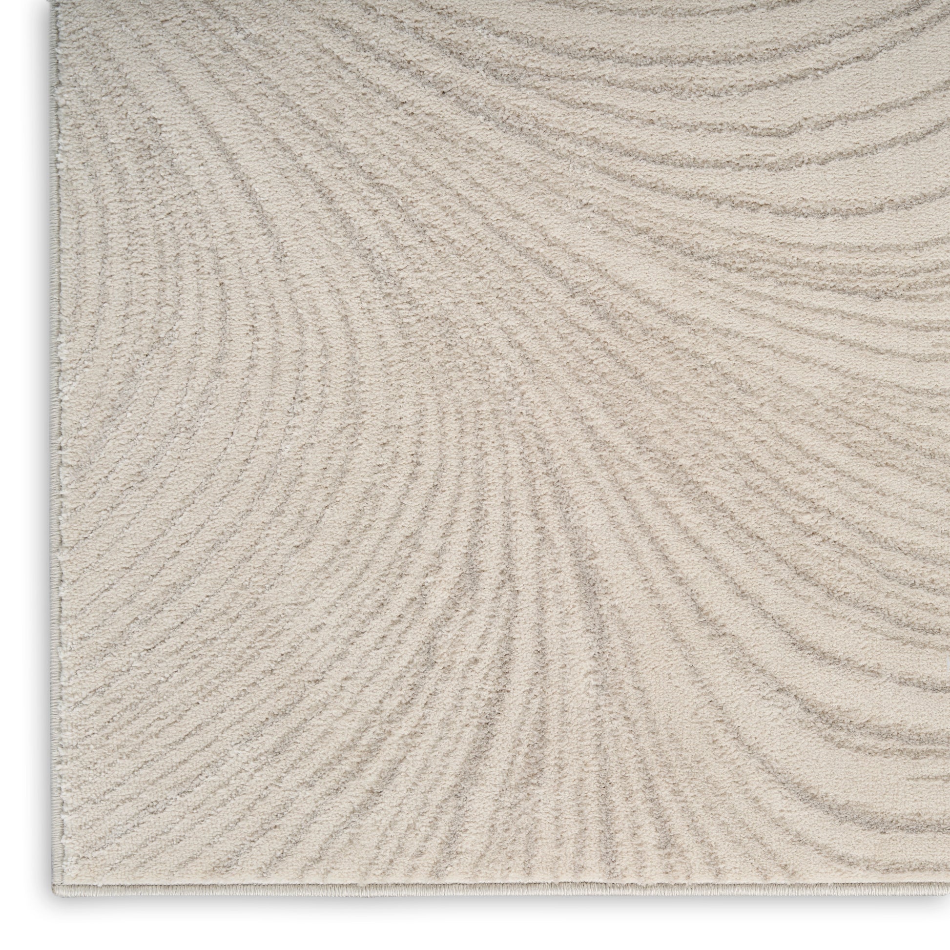 Beige textured rug with subtle curved striped lines in a loop-pile; rectangular, neutral living room rug.