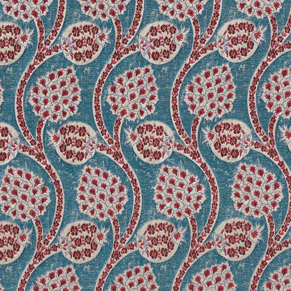 Blue fabric with red and white circular floral medallions linked by curved stems; boho textile for upholstery or curtains.