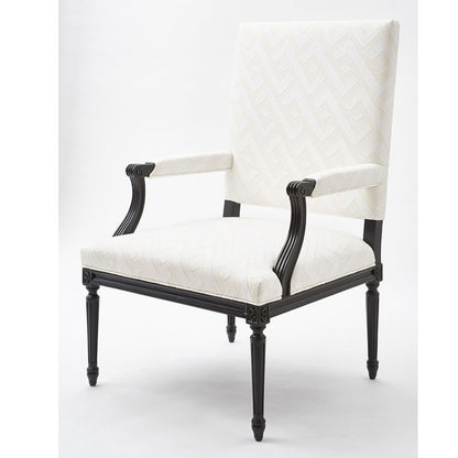 Blue applique-pattern woven fabric upholstery on a tall-back armchair with a black carved wood frame and turned legs.