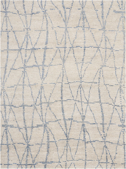 Cream woven fabric with light blue geometric lattice of diamonds and triangles; textured upholstery.