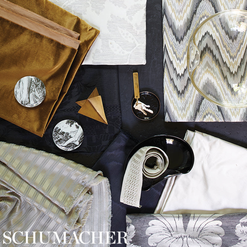 Satin swatches: pearl grey plain satin fabrics on a dark surface.