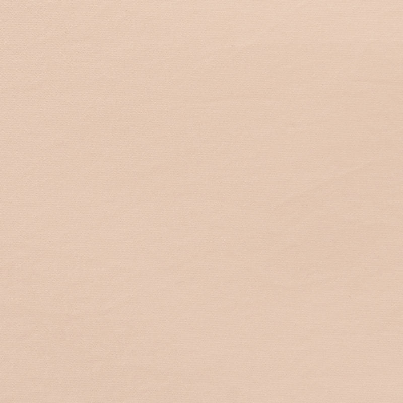 Peachy-beige textured background with subtle grain.