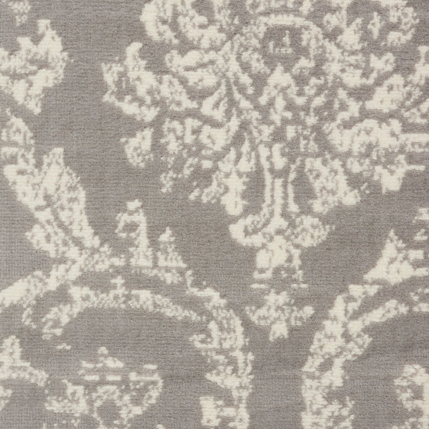 Gray damask textile with ivory floral motif; elegant jacquard upholstery or drapery fabric.