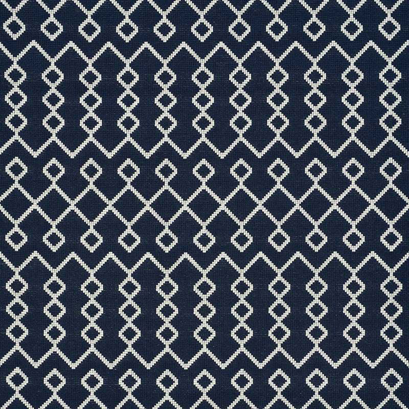 Navy woven fabric with a white interlocking diamond lattice geometric pattern.