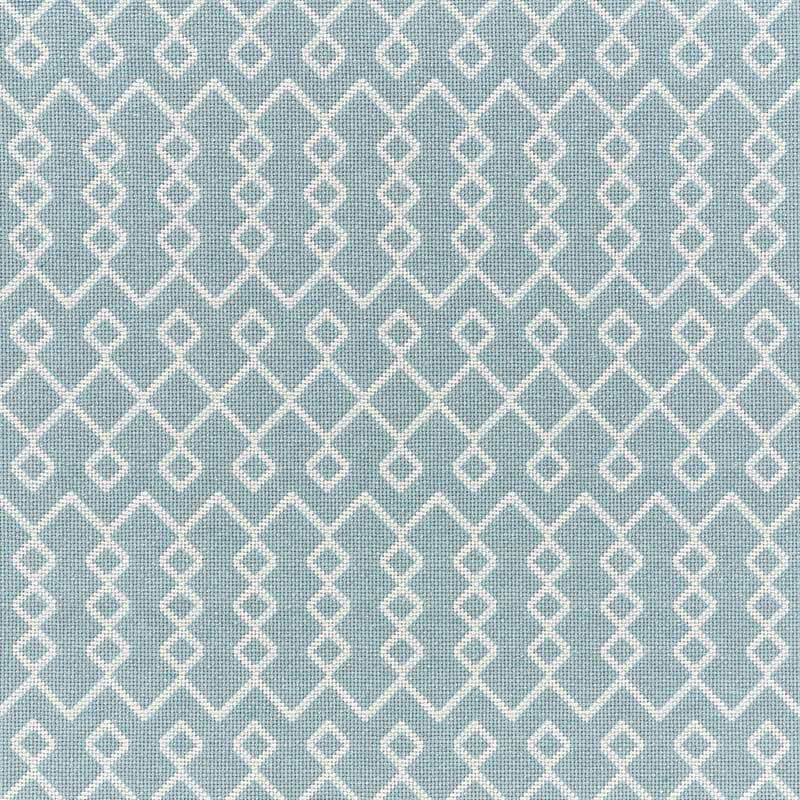 Blue-gray fabric with white interlocking diamond lattice and small dot details; geometric textile for upholstery or curtains.
