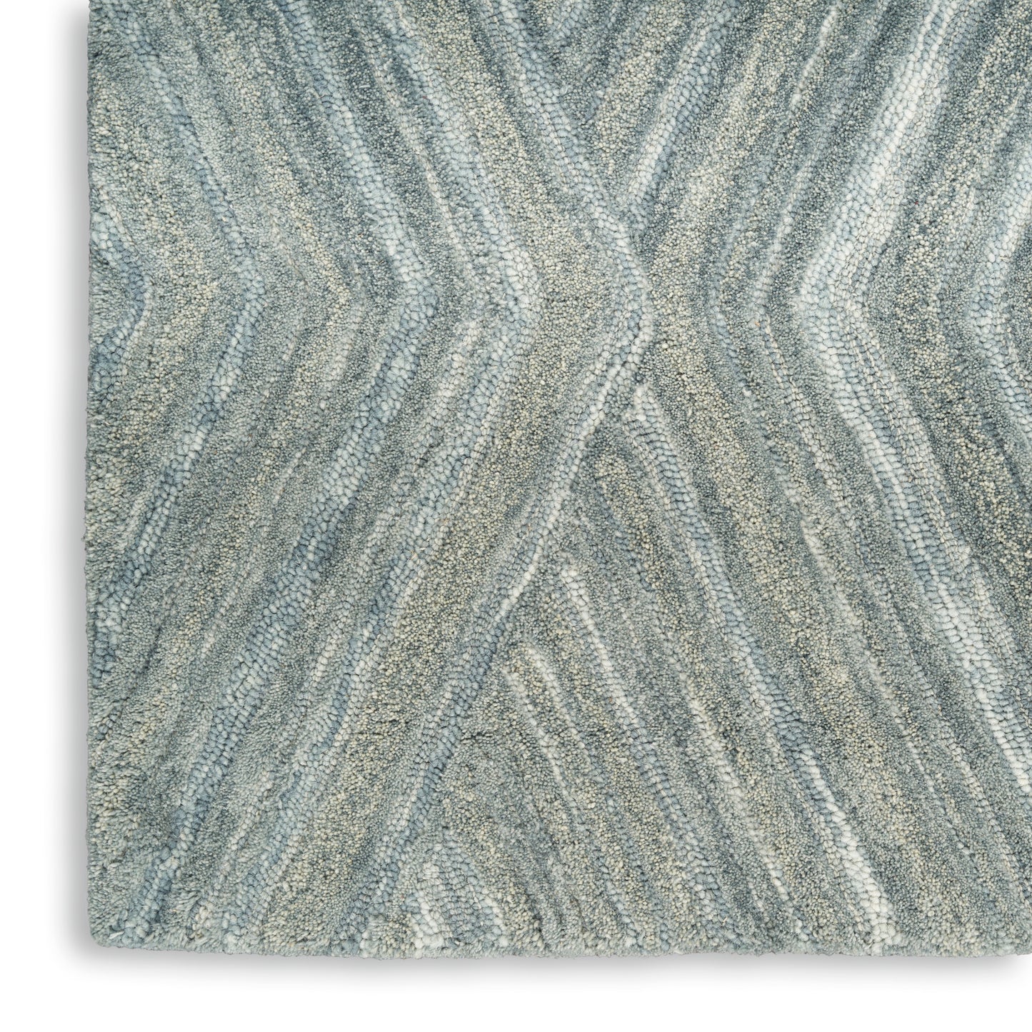 Grey-blue rug with soft, wavy chevron pattern and plush pile.