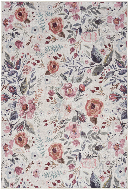 Pastel floral area rug featuring pink-peach roses and blue-grey leaves on a beige woven background.