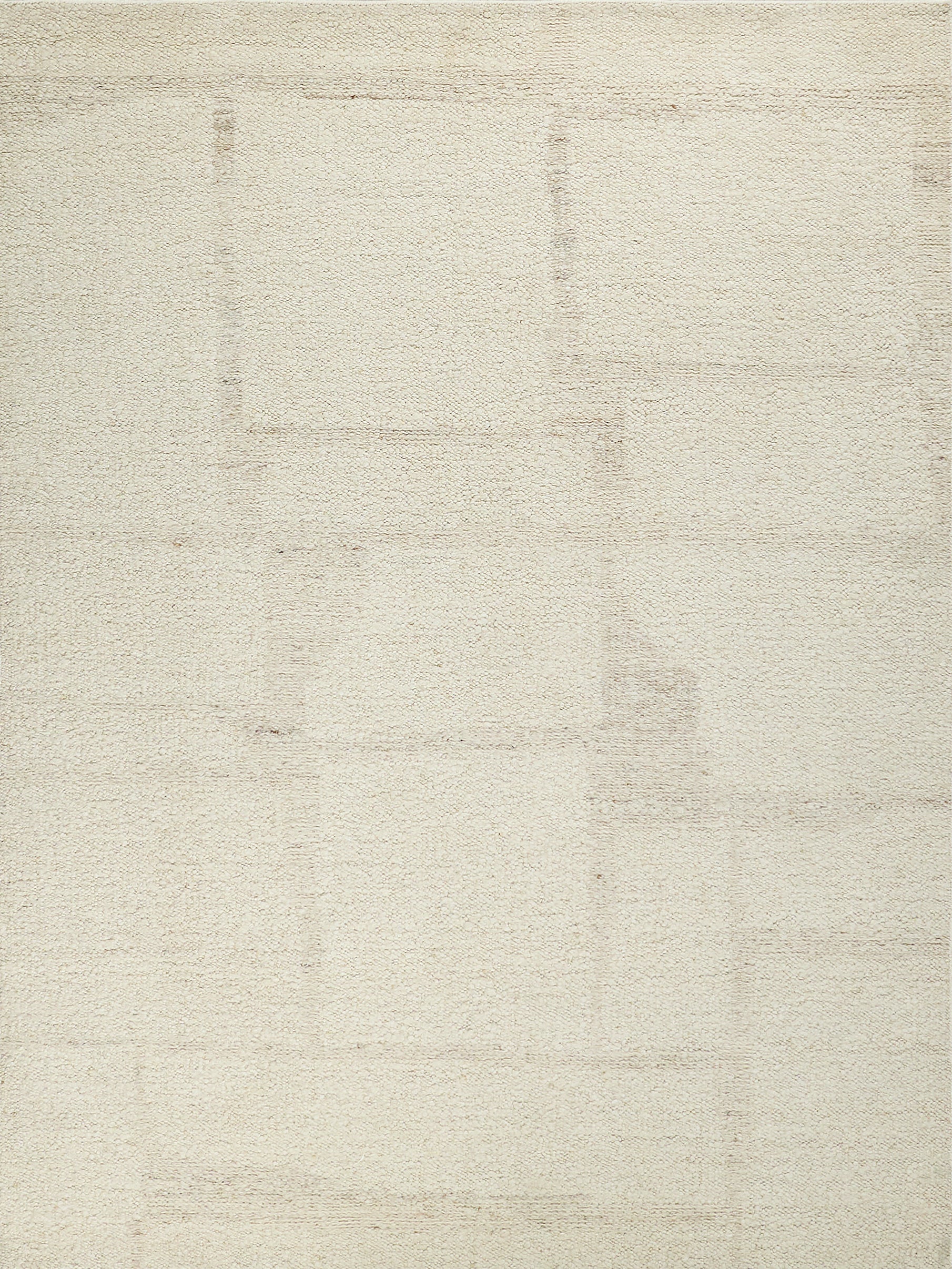 Cream-beige flat-weave rug with subtle rectangular patch patterns for neutral decor.