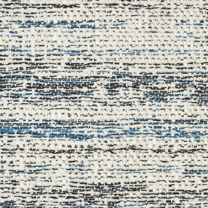 Cream woven rug with blue and black horizontal stripes and geometric diamond motifs; textured flat weave.