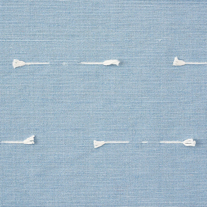 Light blue woven fabric with white running stitches across, showing textile texture and casual seam detail.