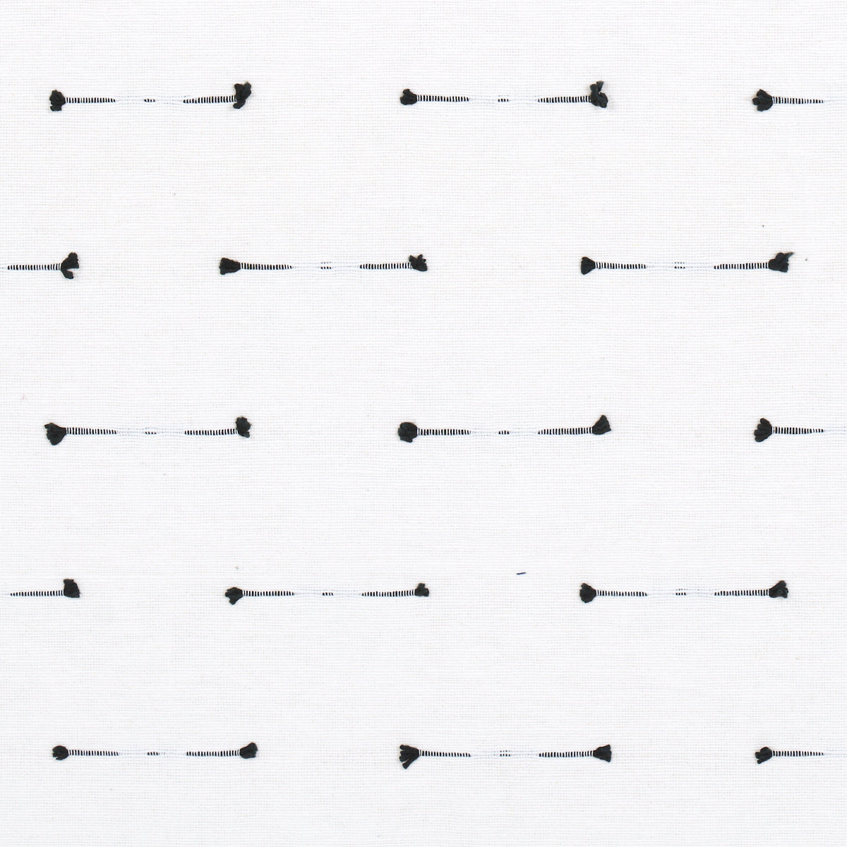 White fabric swatch with repeating small black dash stitches & rounded end dots; minimalist textile pattern.