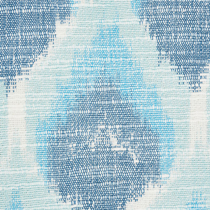 Blue and white woven rug with geometric diamond medallion pattern and textured weave.