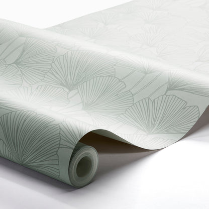 Pale mint-green wallpaper roll with a subtle fan-shaped leaf pattern, partially unrolled.
