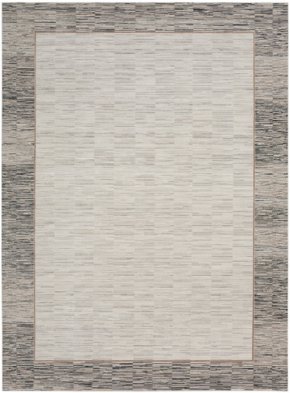 Rectangular rug with light beige center, slim brown border, and textured gray outer frame; modern transitional style.