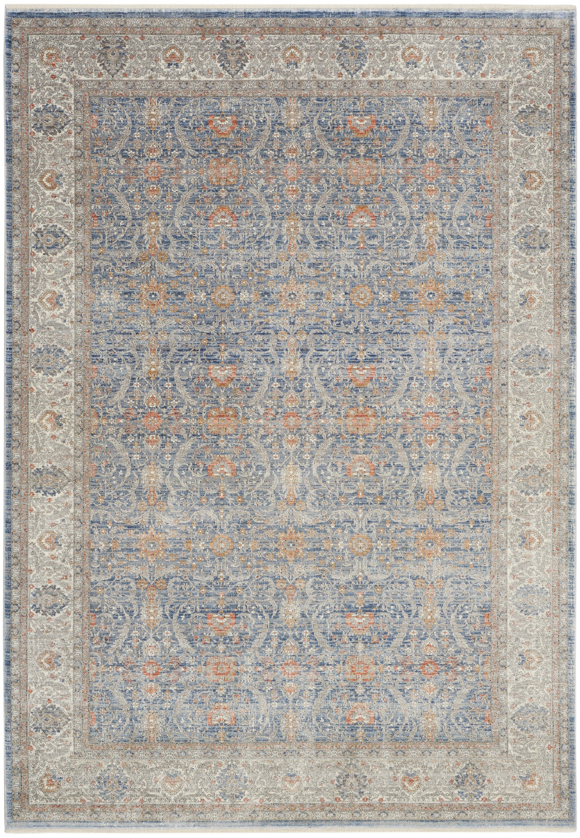 Blue oriental rug with a pale ivory border and rust accents; dense floral/medallion pattern in blue, cream, and tan.