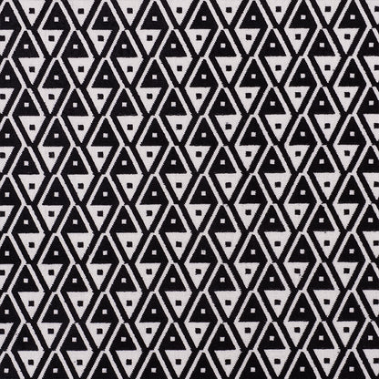 Black and white geometric fabric with interlocking diamond and triangle pattern, bold graphic textile print.