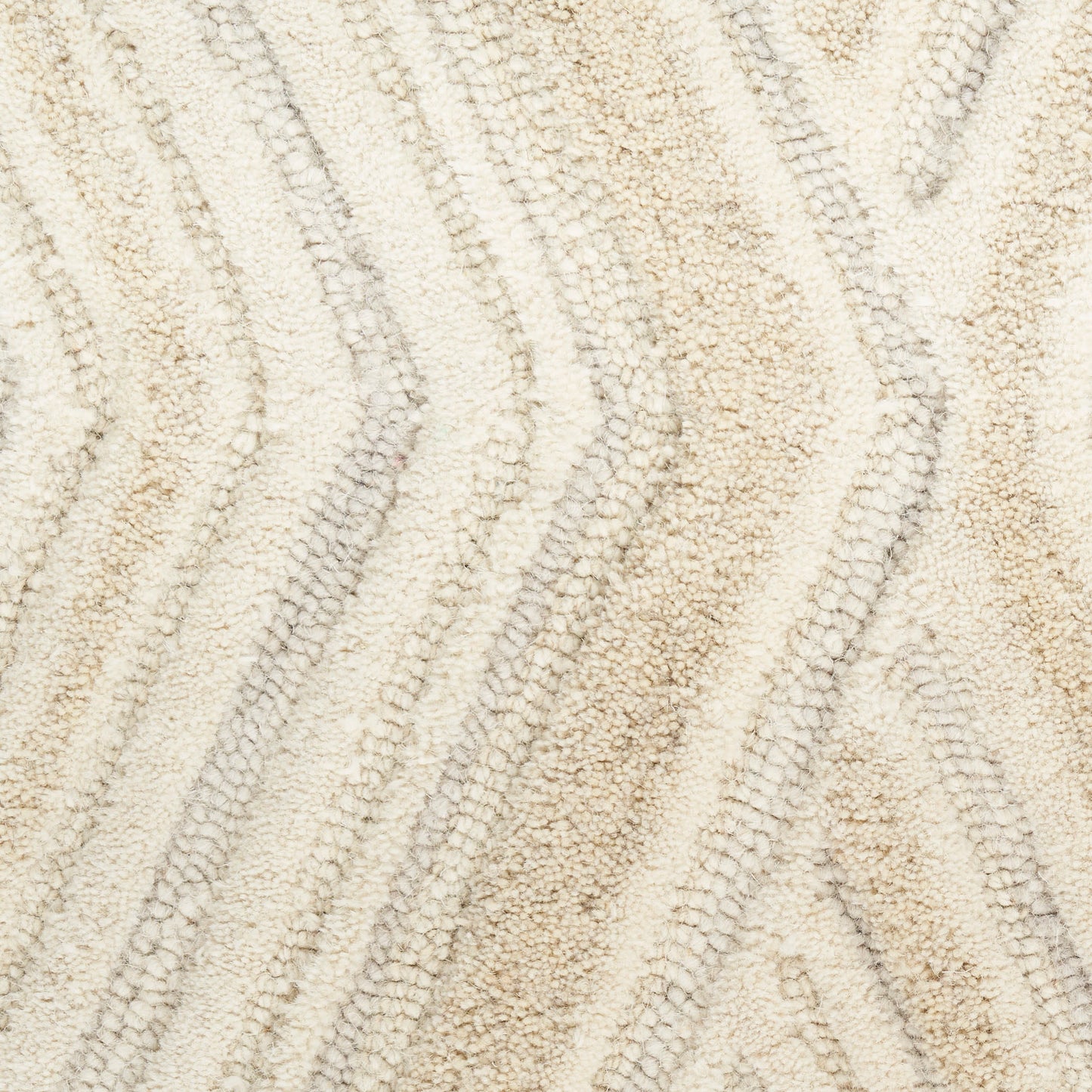 Beige plush rug with soft shag pile and wavy chevron pattern in cream and taupe tones, ideal for living room decor.