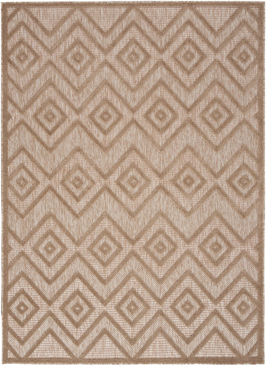 Beige geometric rug with repeating diamond and chevron pattern, textured woven jute-like fabric.