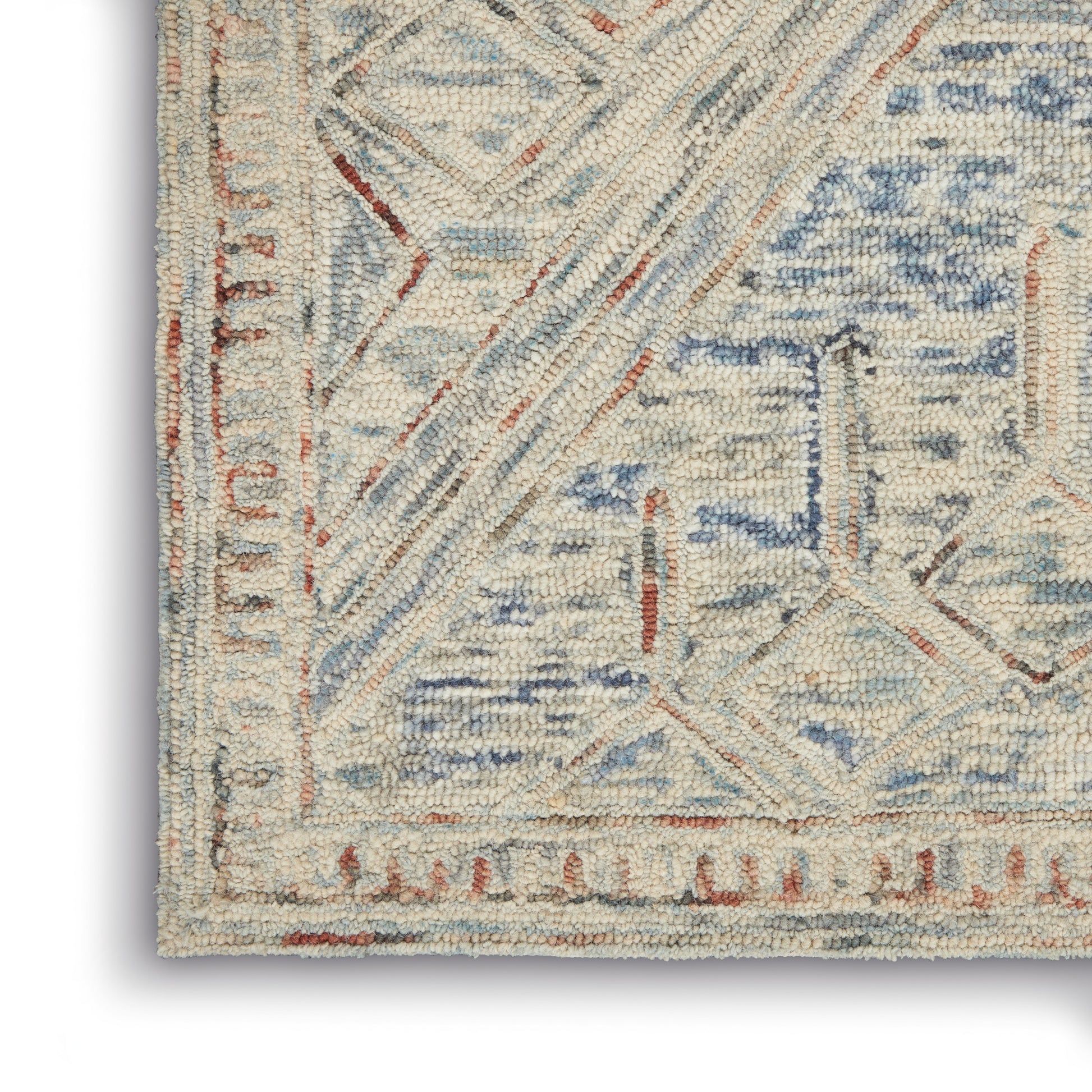 Cream geometric area rug with pale blue and rust accents; textured woven pile with bordered motif.