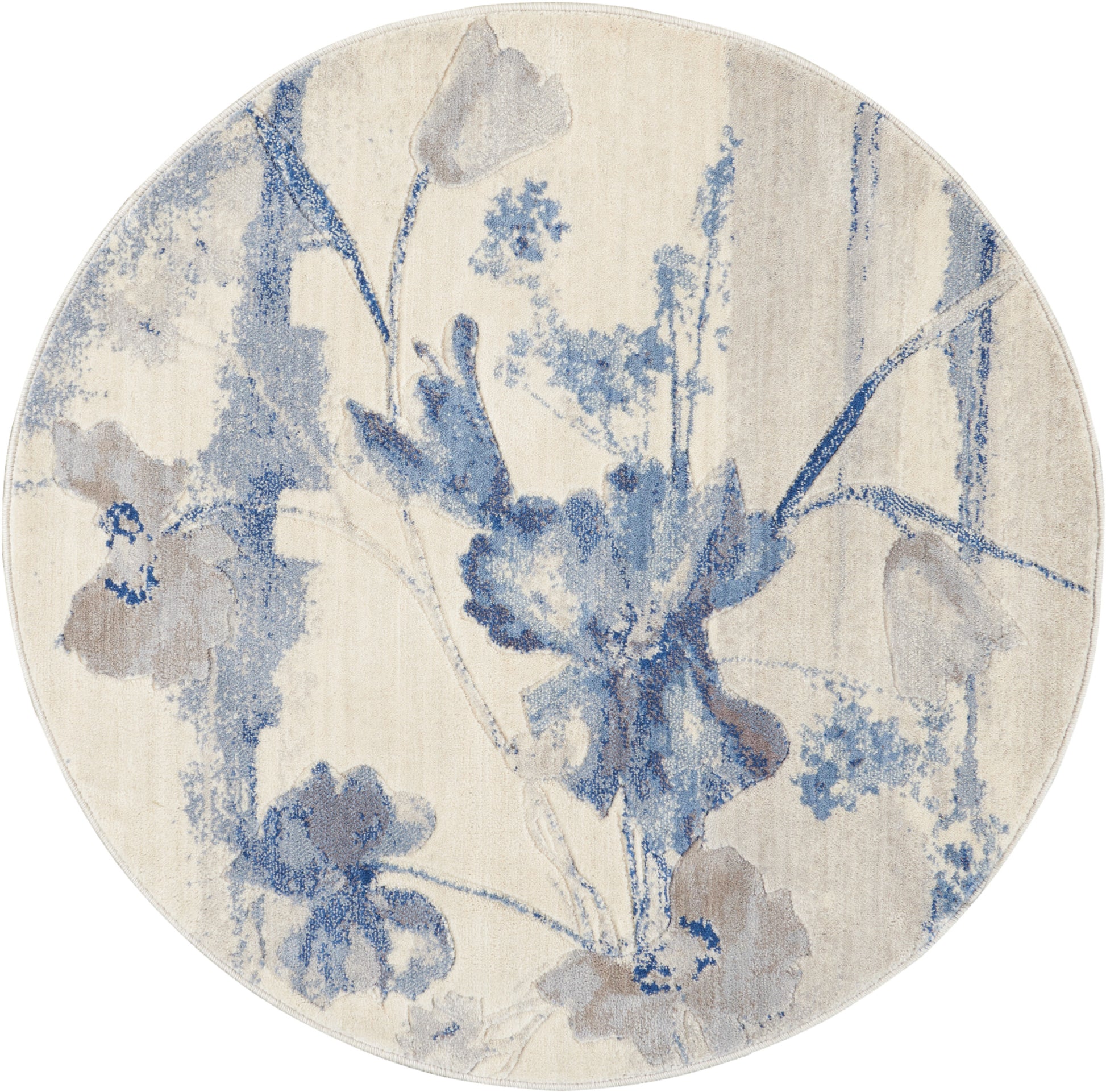 Round beige rug with blue watercolor floral pattern; soft decorative floor accent.