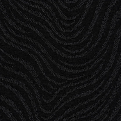 Black fabric with subtle raised wavy pattern and velvety sheen; ideal for upholstery or evening wear.