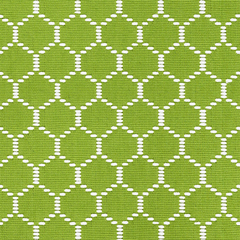 Lime green fabric with a white dotted circle lattice pattern; lightweight textile for clothing or home decor.