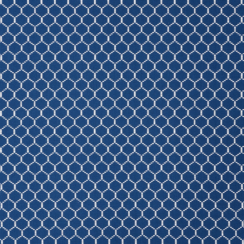 Blue fabric with a white circular lattice pattern; small white circles form a repeating geometric print.