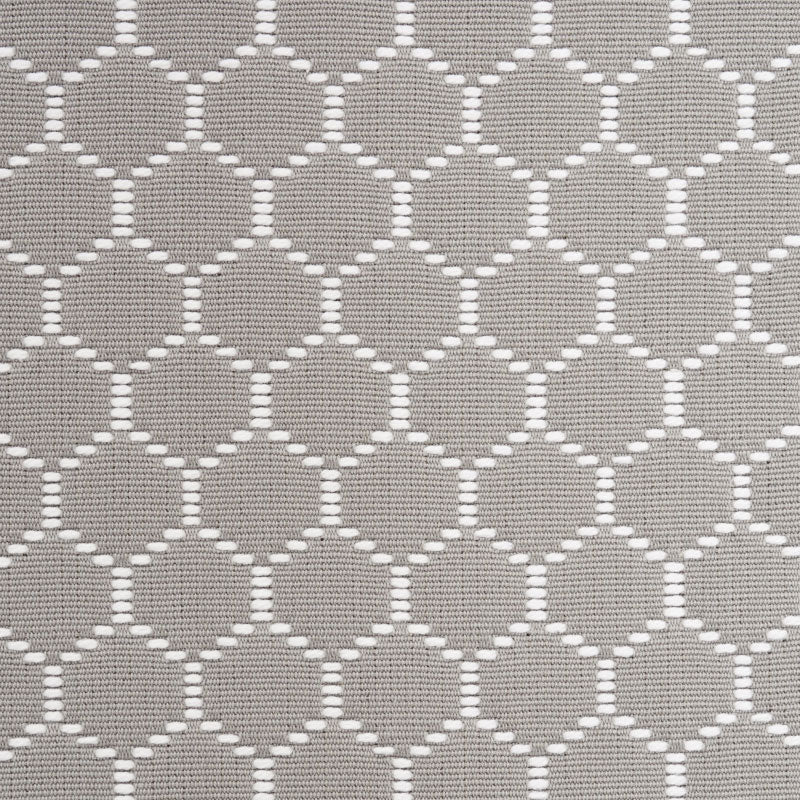 Grey woven fabric with white interlocking circle lattice pattern, versatile for upholstery or home decor.