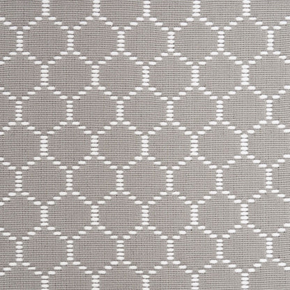 Grey woven fabric with white interlocking circle lattice pattern, versatile for upholstery or home decor.