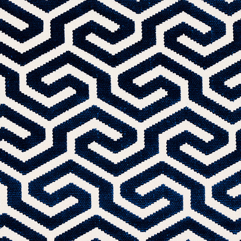 Navy blue and white chevron border on left and top surrounds a solid gray center panel.