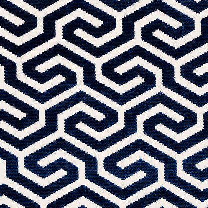 Navy blue and white chevron border on left and top surrounds a solid gray center panel.