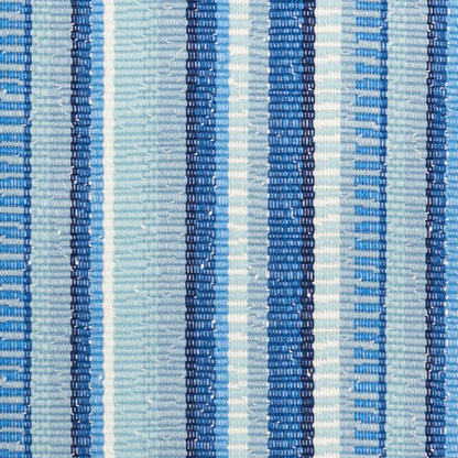 Close-up of blue and white striped woven fabric with alternating navy, royal blue, and light blue vertical stripes.