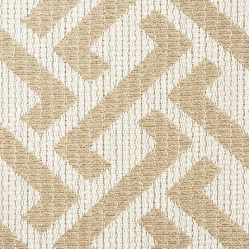 Beige and cream woven fabric with a bold geometric chevron/maze pattern and ribbed texture.