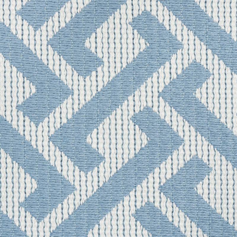 Blue and white chevron woven fabric with raised texture; versatile for upholstery or cushions.