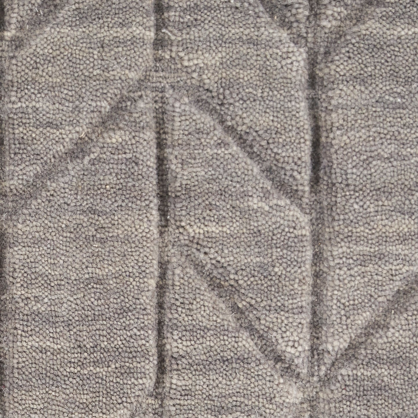 Gray boucle fabric with dense loop texture and raised geometric chevron/diamond pattern.
