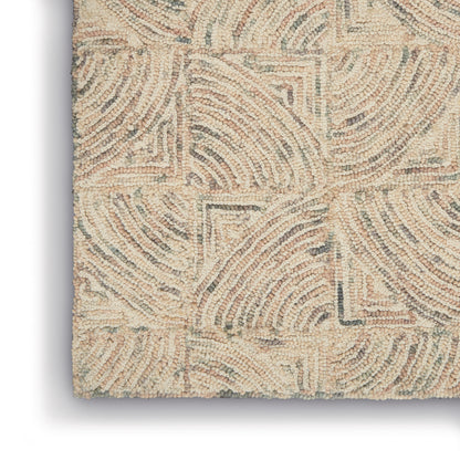 Beige loop-pile rug with embossed geometric swirls and square blocks; soft, neutral decor.