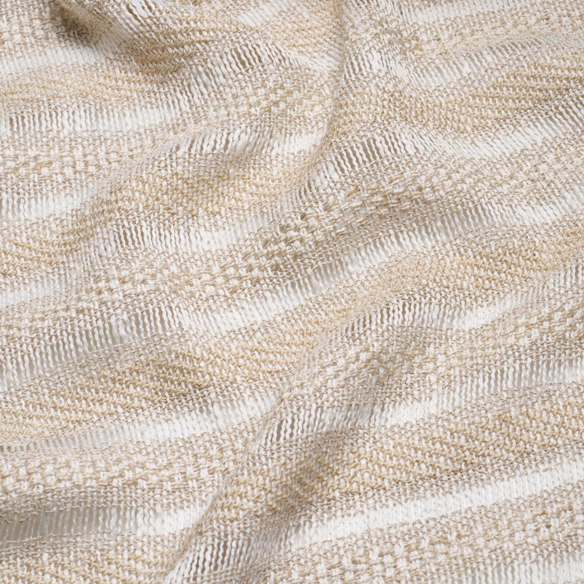 Beige and cream striped woven textile with a soft, textured surface, like a cozy throw.
