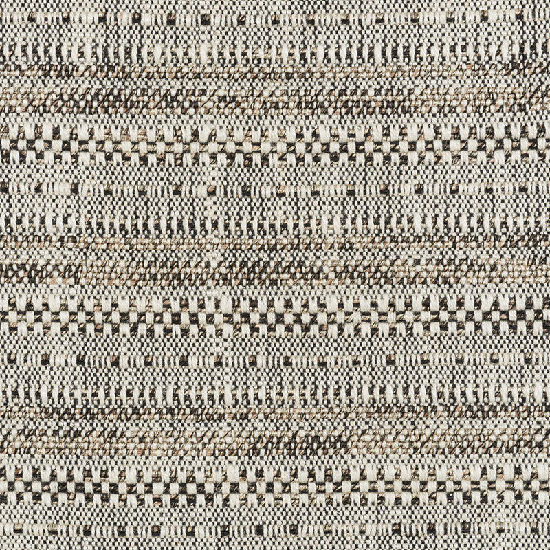 Beige, black & cream woven textile with geometric stripes & checker patterns; rustic rug or upholstery fabric.