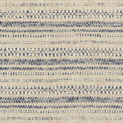 Beige woven rug with navy blue stripes and dotted motifs; natural-fiber, coastal rustic style.