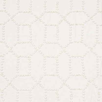 Cream fabric with raised dotted lattice pattern forming squares; soft textured material for upholstery or drapery.