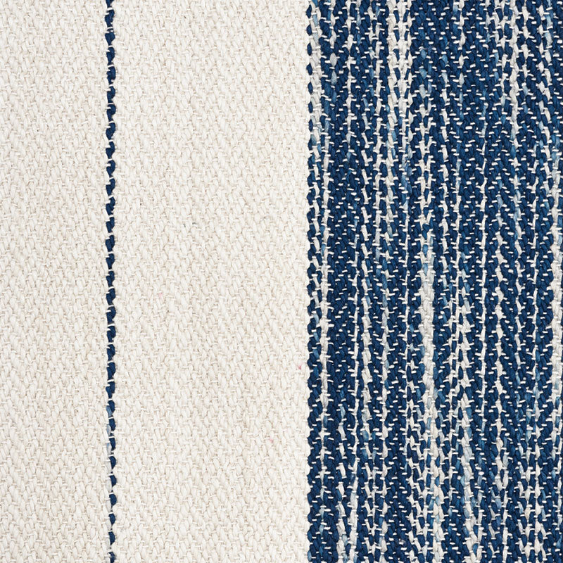 Beige woven textile with navy blue vertical stripes and textured weave.