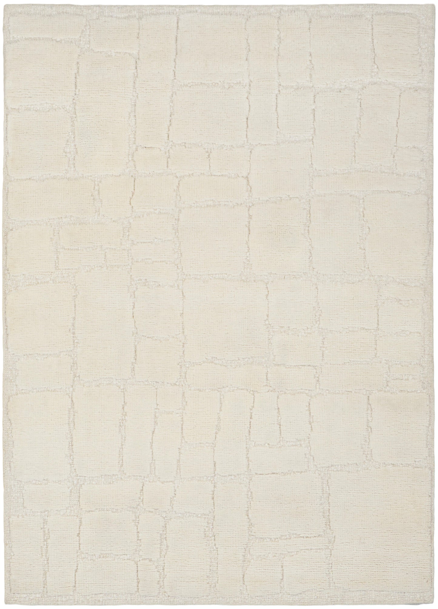 Cream area rug with a subtle rectangular tile pattern in soft beige, plush textured pile.