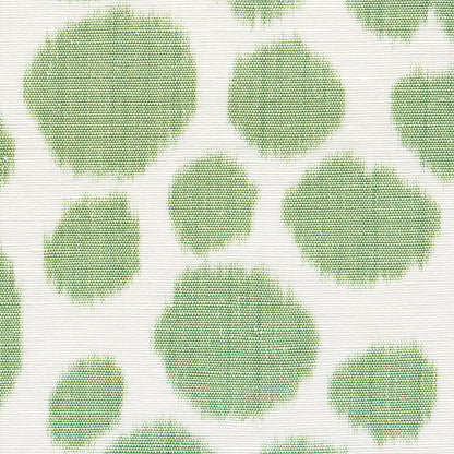 Mint green circular polka dots on cream knit fabric; textured, casual textile print.