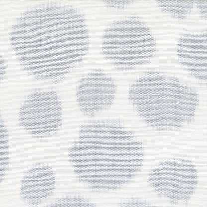 Cream fabric with light blue polka dot pattern; woven texture, versatile for upholstery or drapery.