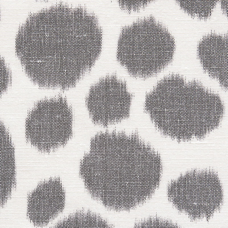 Grey leopard print pattern on wallpaper; irregular round spots with fuzzy edges on a light background.