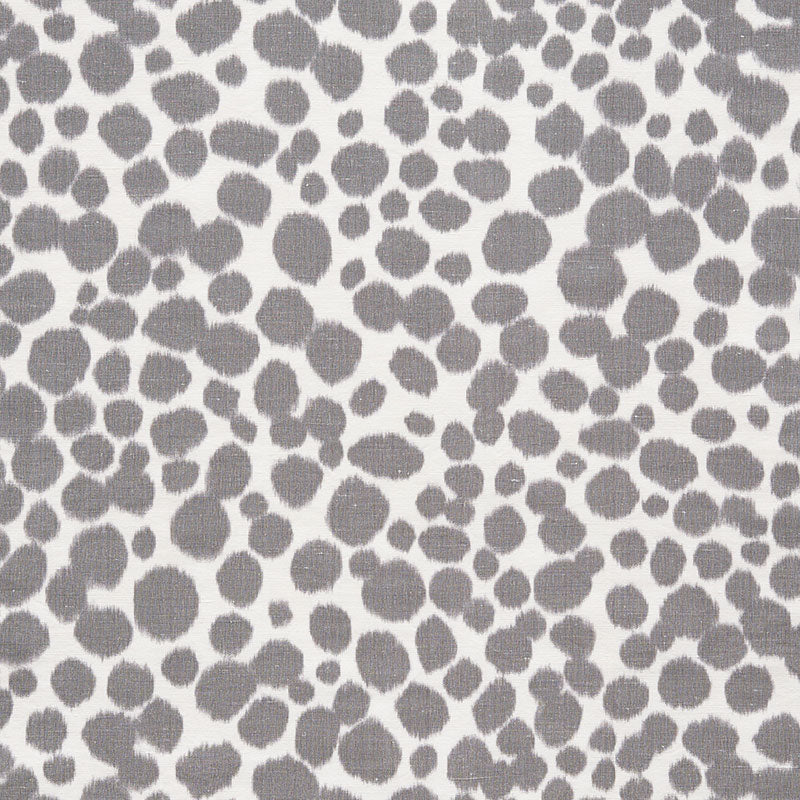 Gray irregular circular polka-dot pattern on white fabric; soft textile for clothing or home decor.