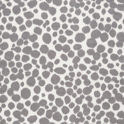 Gray irregular circular polka-dot pattern on white fabric; soft textile for clothing or home decor.