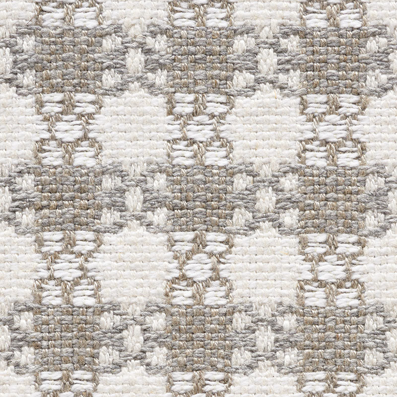 Neutral woven rug with cream and taupe diamonds in a geometric pattern, textured loop pile.