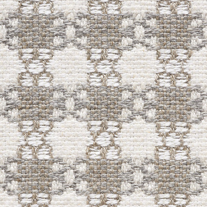 Neutral woven rug with cream and taupe diamonds in a geometric pattern, textured loop pile.